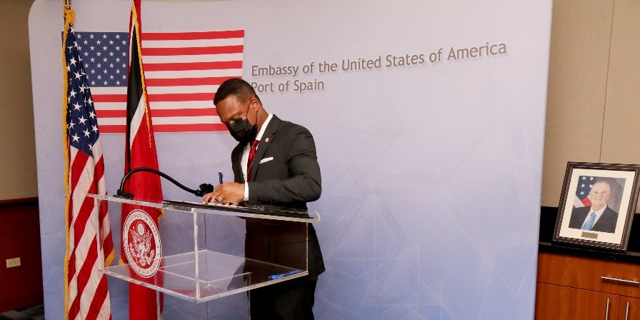MINISTER BROWNE SIGNS CONDOLENCE BOOK - US Ambassador Mondello