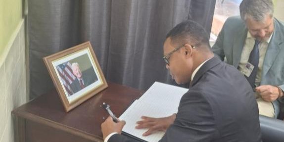 Minister Browne signs Condolence Book for former US President James Earl Carter Jr